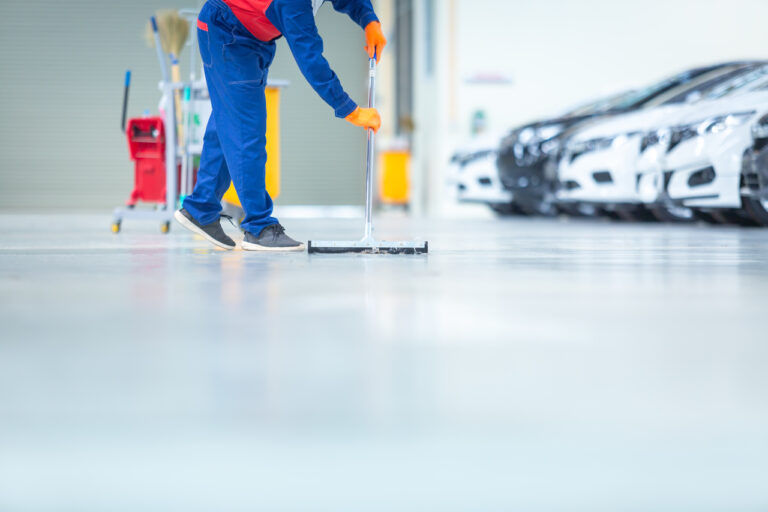 A person cleaning a polyurethane floor