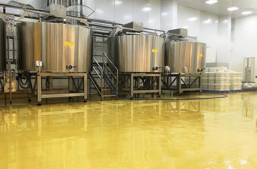 Seamless hygienic resin flooring in food processing facility