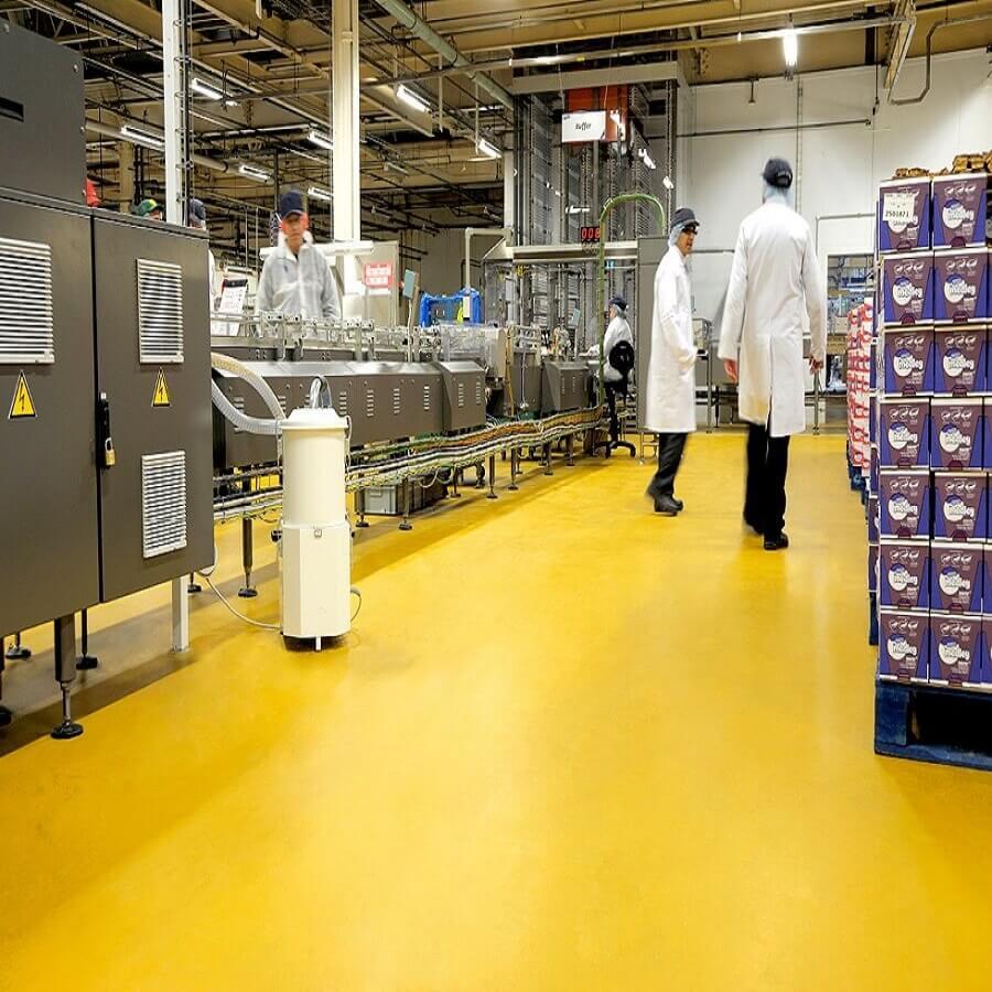 Heavy-duty cementitious urethane flooring installed in an industrial facility