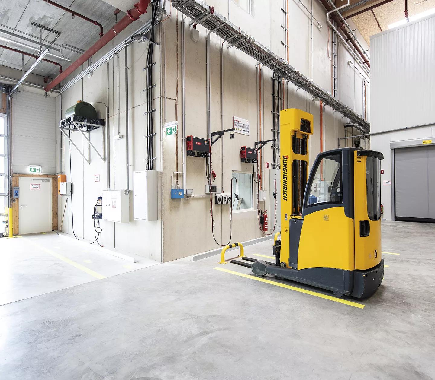 Industrial forklift battery charging station with heavy-duty epoxy flooring