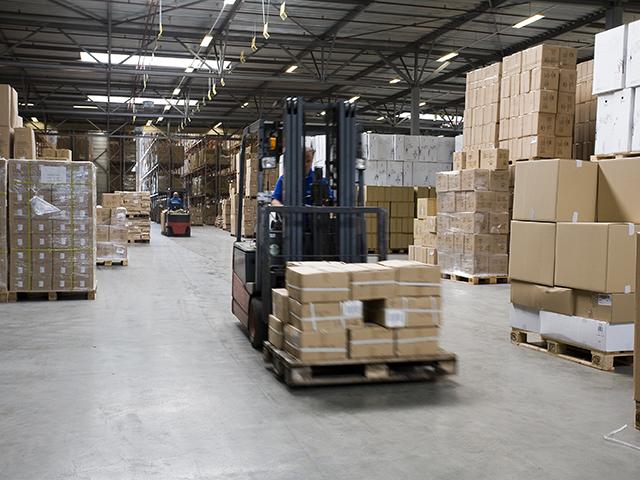 Forklift operating on an industrial warehouse floor