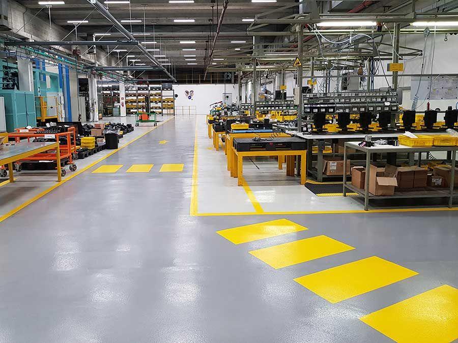 Industrial epoxy flooring in a manufacturing factory