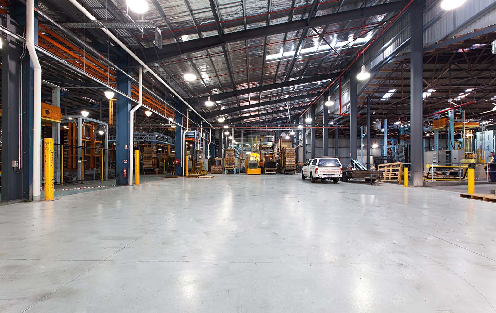 Industrial warehouse floor with forklift and concrete flooring